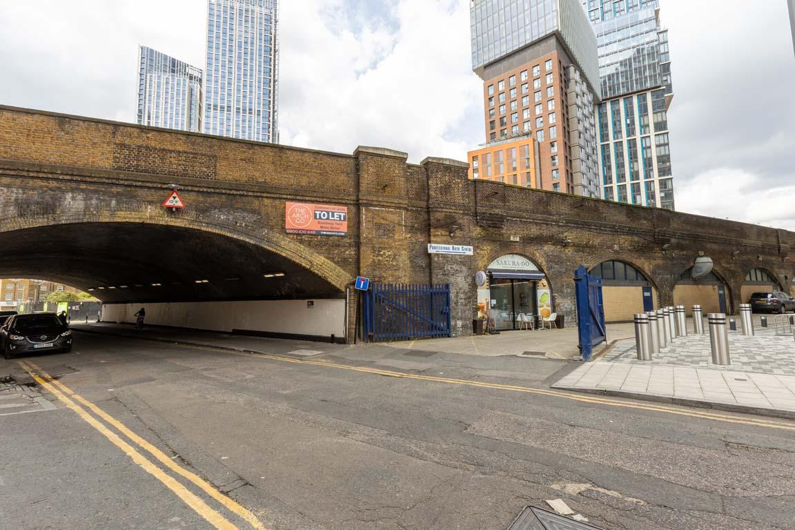 An estate, with multiple warehouse units next to each other. The arches have closed electric roller shutter entrances.